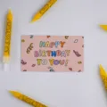 Pink happy birthday greeting card detail shot with yellow smiley face candles for party. - Birthday Pink / 30 Packs