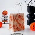 Halloween mini kraft paper gift bag with cute pumpkin pattern and sturdy handles for party. - Pumpkin Broom / 15x12x7cm