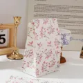 Bolsa de regalo de papel con patrón de hojas rosas para embalaje de repostería y almacenamiento. - Rama con flores