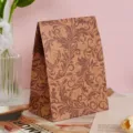 Detailed view of the vintage leaf patterned paper gift bag showcasing its texture. - Large Leaves Pattern / M