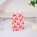 Piccola borsa regalo di carta rosa con ciliegie e manici per feste e caramelle. - Ciliegia / Taglia S