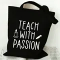 Detail view of a black canvas tote bag with teacher quote print, large capacity and durable. - Style 10