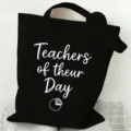 Black canvas tote bag detail, featuring custom teacher theme print, minimalist design. - Style 8