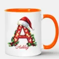 Taza de café de cerámica con inicial de Navidad personalizada con nombre Ashley para regalo. - 350ml / Naranja