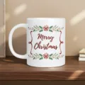 Christmas ceramic mug detail with Merry Christmas print and festive holiday decoration. - White (Christmas Green Leaves and Ribbon)