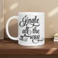Detailed view of white ceramic coffee mug with Christmas Jingle text on wooden desk mockup. - White (Christmas Jingle Bell Ball)