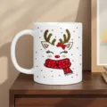 Close-up detail of white ceramic Christmas reindeer mug on wooden table. Festive gift cup. - White (Reindeer)