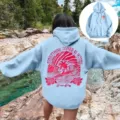 Casual light blue women's hooded sweatshirt with drop shoulder and pink wave back print. - XS / Tops / Light Blue