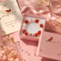 Charming handmade beaded stretch bracelet with red cardinal design, gift box and card. - Color Box / Pink Bird