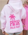 Casual pink hooded sweatshirt with back palm print, comfortable drop shoulder design for daily wear. - XS / Tops / Sakura Pink
