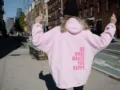 Oversized pink hooded sweatshirt for women, casual drop shoulder hoodie with back graphic. - S / Tops / Pink with Purple Text