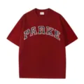 Close-up detail of dark red short sleeve t-shirt with arched plaid logo and neck label. - Red