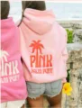 Pink dropped shoulder hoodie with palm tree back print, comfortable casual streetwear style. - XS / Tops / Pink
