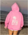 Pink oversized hoodie with palm tree back print and comfortable drop shoulder design. - XS / Tops / Watermelon red