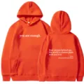 Orange hoodie with motivational back quote, front pocket and drawstring, casual style. - XS / Tops / Orange - White Print