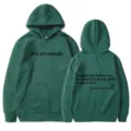 Green pullover hoodie for women featuring letter print, long sleeves and kangaroo pocket. - XS / Tops / Dark Green - Black Print