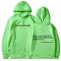Women's green hooded sweatshirt featuring inspirational letter print, pocket and drawstring. - XS / Tops / Green - Black Print