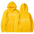 Women solid yellow hoodie with kangaroo pocket, drawstring hood, and inspirational text print. - XS / Tops / Yellow - White Print
