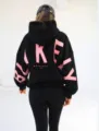Women's black hooded sweatshirt with bold pink letter print back design and thick fleece fabric. - Black Red