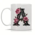 Ceramic coffee mug detail featuring elegant pink roses and vintage scroll letter A print design. - Letter A