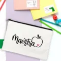Detail view of the white canvas pencil case featuring Maestra lettering and cute apple design for teachers. - White Black Text Heart Apple Style (10)