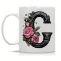 White ceramic coffee mug featuring an elegant vintage ornate letter C with pink roses. - Letter C
