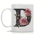 Detailed view of white ceramic coffee mug featuring ornate floral letter D design for office. - Letter D