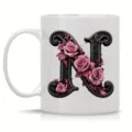 White ceramic coffee mug featuring an elegant vintage letter N and pink roses design. - Letter N