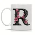 White ceramic coffee mug with ornate floral letter R design, perfect for office and daily use. - Letter R