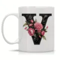 White ceramic coffee mug featuring an elegant floral black letter V design for office use. - Letter V