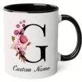 Custom letter G ceramic coffee mug with watercolor floral design and personalized name text. - 350ml / Letter G