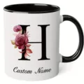Ceramic coffee mug detail showing custom letter H print and elegant watercolor floral design. - 350ml / Letter H