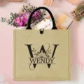 Personalisierte Jute-Tasche mit Initialen und Blumenmuster für Strand und Reisen. - Buchstabe W