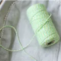 Detailed view of colorful cotton twine, green, white and yellow twisted bakery string. - Yellow White Fruit Green (100 Yards Pack)