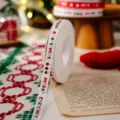 Christmas grosgrain ribbon detail, white fabric with festive print for gift wrapping. - White