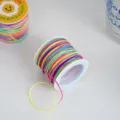 Detail view of vibrant rainbow gradient nylon cord spool, perfect for DIY crafts and hanging tags. - 50 Meters/Pack / Gradient Multicolor