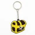Close-up detail view of the PVC soft rubber pirate treasure chest keychain pendant and metal ring. - Treasure Chest
