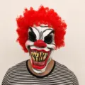 Scary latex clown mask with red curly hair for Halloween party and horror costume props. - Big Teeth Clown