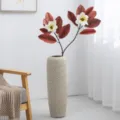 Artificial magnolia flower branches set with tall textured ceramic vase for modern home decor. - Two-Fork 15-Leaf Red Leaf White Flower