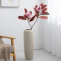 Artificial magnolia flower branch with textured tall vase, faux floral arrangement for home decor. - Two-Fork 15-Leaf Red Leaf Red Flower