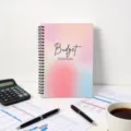 Spiral budget planner with a colorful gradient cover, ideal for daily organization and notes. - Budget Planner