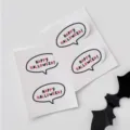 Detailed close-up of Halloween speech bubble stickers featuring festive holiday typography. - 12 Pieces/Pack