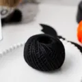 Black hemp rope for DIY crafting and holiday gift wrapping, ideal for handmade projects. - Black