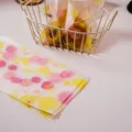 Frosted packaging bags with cute circle patterns, ideal for cookies, nuts, and baking treats. - Pink and Yellow Circle Style / 50 Pieces