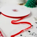 Red velvet ribbon roll for Christmas gift wrapping, DIY crafts, and holiday party decoration. - Red