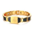 Detail view of men gold stainless steel magnetic bracelet with Masonic symbol and carbon fiber. - Gold