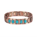 Copper magnetic bracelet detail view, showcasing turquoise stone inlay and therapeutic magnet links. - Blue