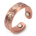 Close-up detail of the embossed floral red copper magnetic open ring showing texture. - Adjustable / Copper Red-2