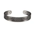 Magnetic copper cuff bracelet with Celtic dragon knot pattern in dark gunmetal finish. - Antique Silver