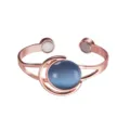 Rose gold magnetic copper bracelet detail showing blue synthetic stone and moon design. - Blue - Artificial Stone